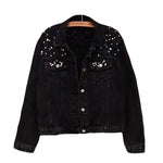 Close-up of spliced embellishment panel detail on women's denim-look jacket