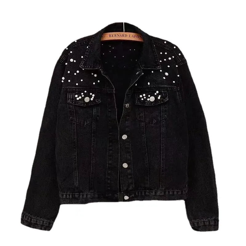 Close-up of spliced embellishment panel detail on women's denim-look jacket