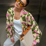 Oversized floral bomber jacket worn — side angle