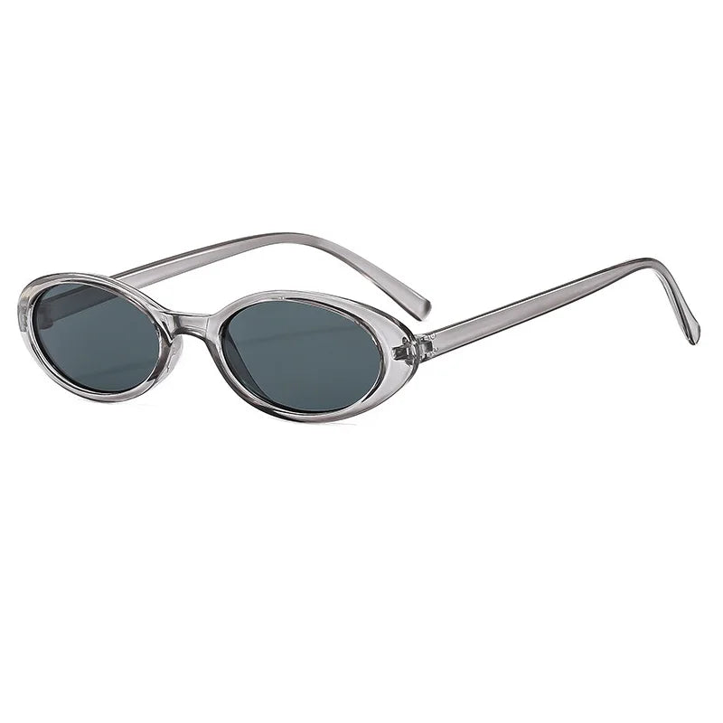 Gray-Black Model wearing small oval cat eye sunglasses, alternate lifestyle shot