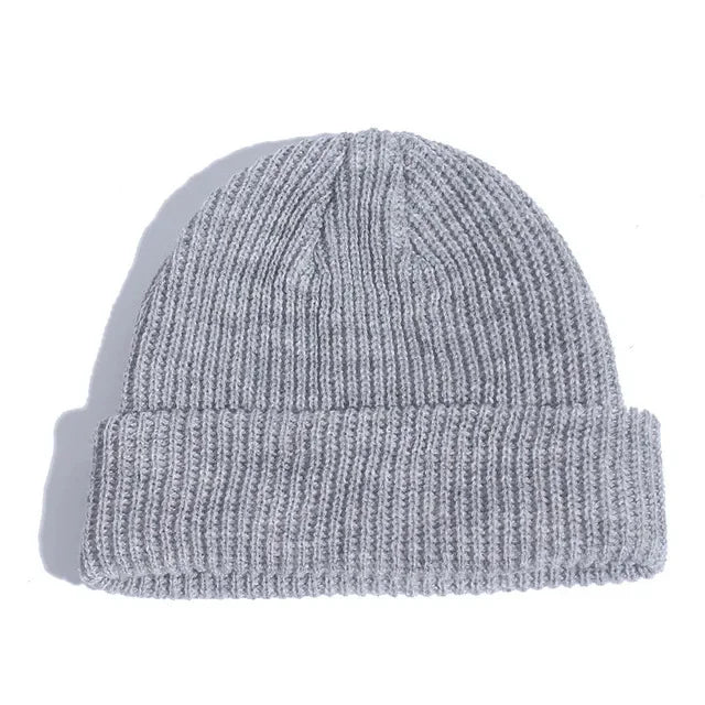Gray knit beanie on a white background