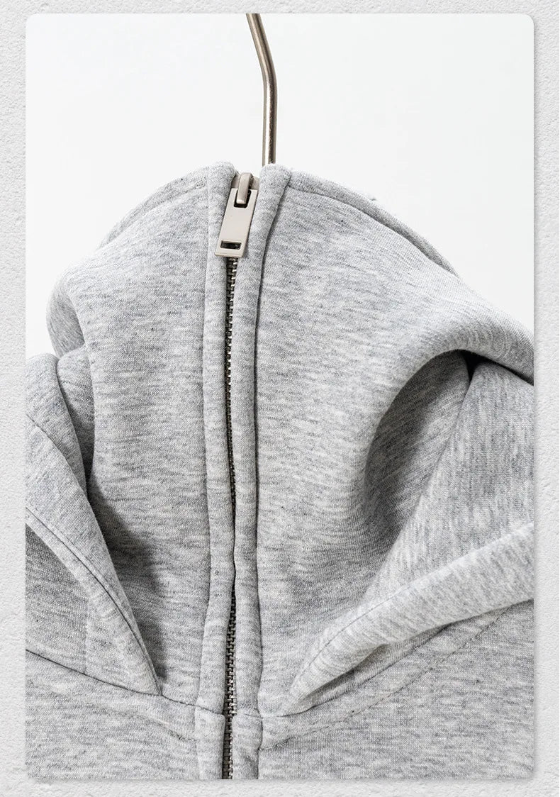 Gray hoodie with a zipper on a white background