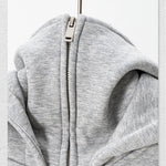 Gray hoodie with a zipper on a white background