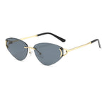 Sunglasses with gold frame and black arms on a white background