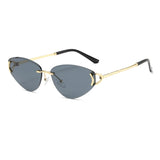 Sunglasses with gold frame and black arms on a white background