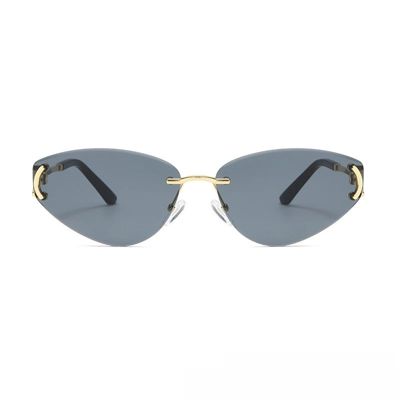 Sunglasses with gold frames and black arms on a white background