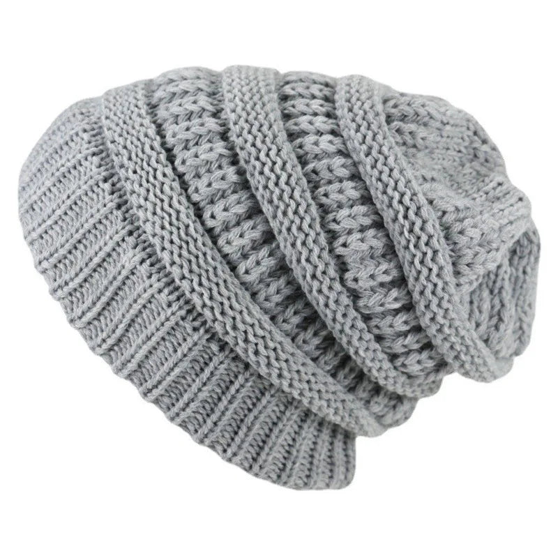 Gray knitted beanie on a white background