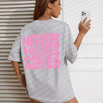 Gray Wavy letter print oversized graphic tee — neck detail
