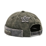 Green Lifestyle shot of model wearing acid wash brimless cap