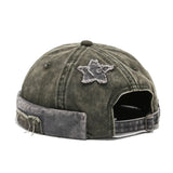 Green Lifestyle shot of model wearing acid wash brimless cap