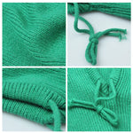 Collage of green knitted fabric with a knot on a white background