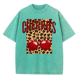 Green-Xy379 Model in loose fit cherry leopard O-neck graphic tee, outdoor