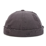 Grey Brimless docker hat lifestyle shot, casual street styling