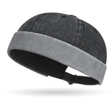 Black beanie with gray band on a white background