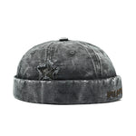 Grey Distressed star brimless hat worn, side view