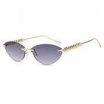 Sunglasses with gold frame and gradient lenses on a white background