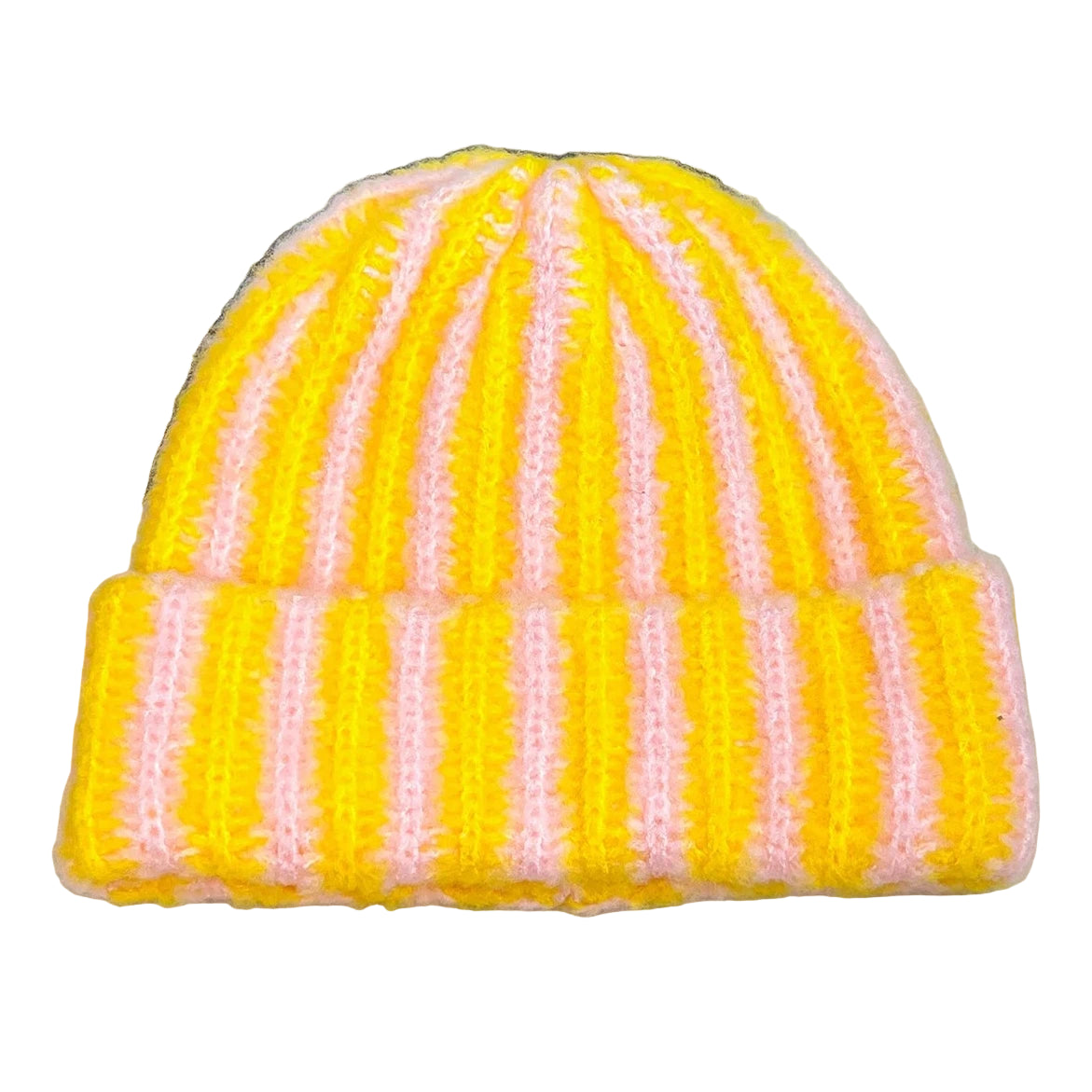Striped yellow and pink beanie on a textured surface