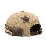 Khaki Close-up of acid wash texture on cotton brimless cap