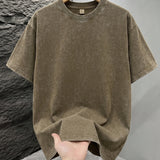 Khaki Mineral washed oversized graphic tee, close-up texture