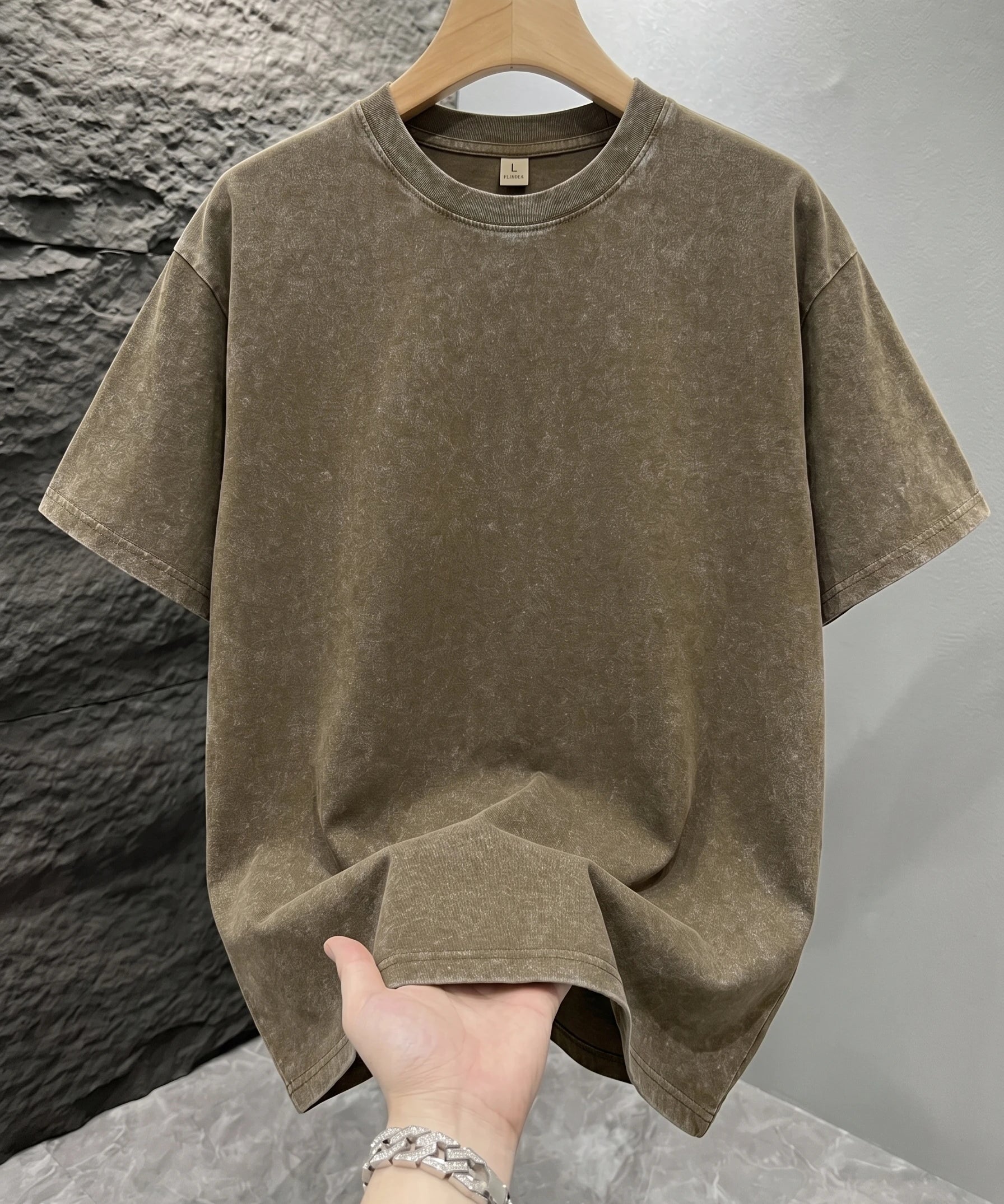 Khaki Mineral washed oversized graphic tee, close-up texture