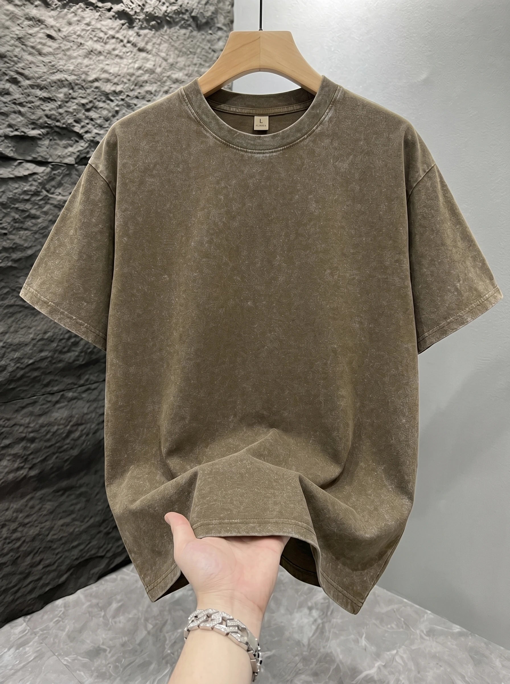 Khaki Mineral washed oversized graphic tee, close-up texture