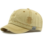 Khaki Short brim baseball cap worn on model — front