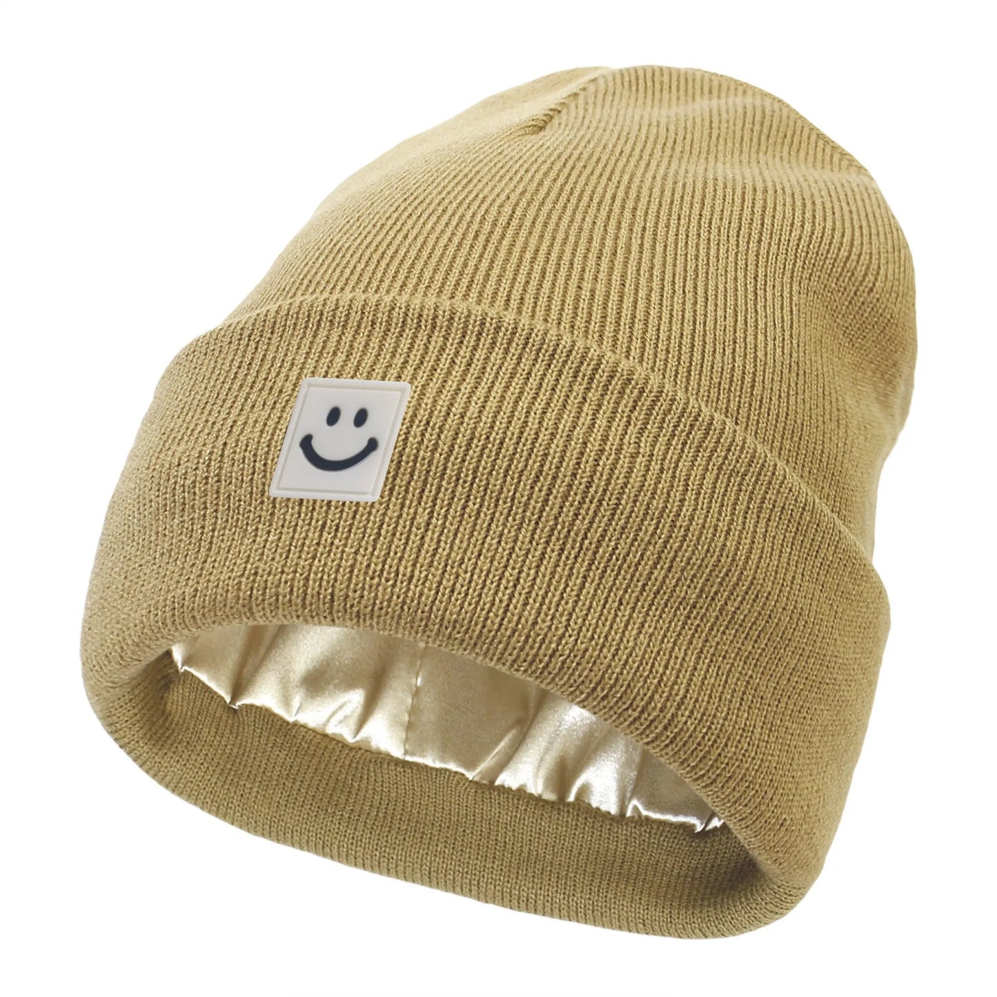 Khaki knit beanie with a smiley face label on a white background
