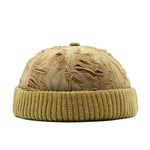 khaki beanie with textured pattern on a white background