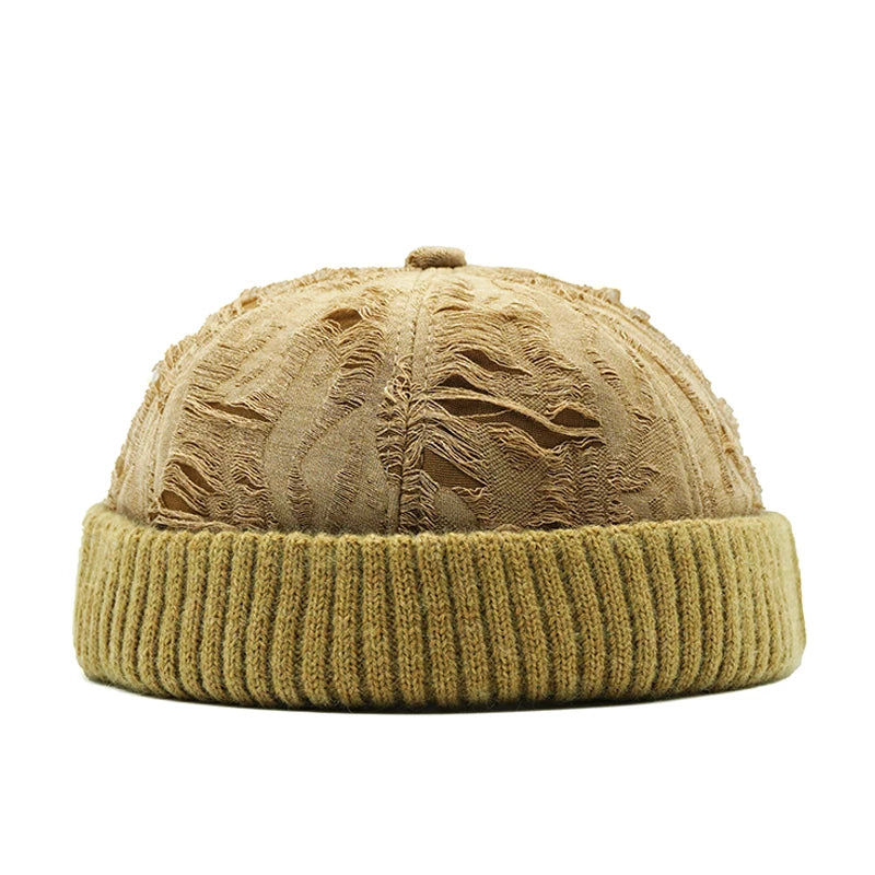 khaki beanie with textured pattern on a white background
