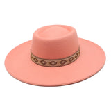 Leather pink wide-brim felt fedora hat, close-up detail of brim and crown