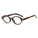 Leopard Clear Model wearing small oval sunglasses in alternate colorway — on-face view