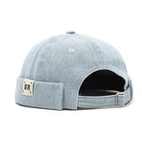 Light blue denim cap with a patch on a white background