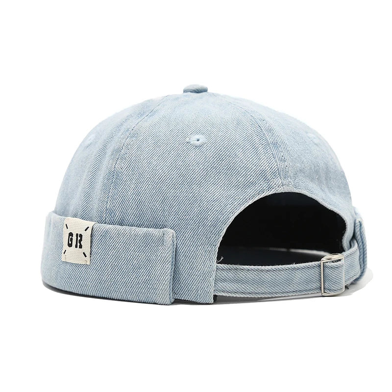 Light blue denim cap with a patch on a white background