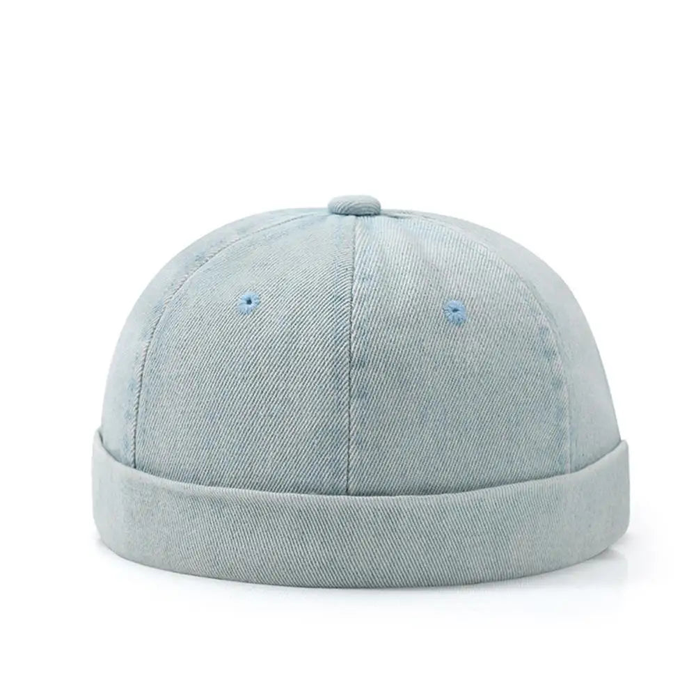 Light blue denim cap on a white background