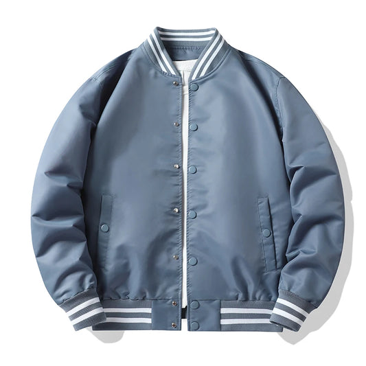 Blue bomber jacket with white and gray striped cuffs and collar on a white background