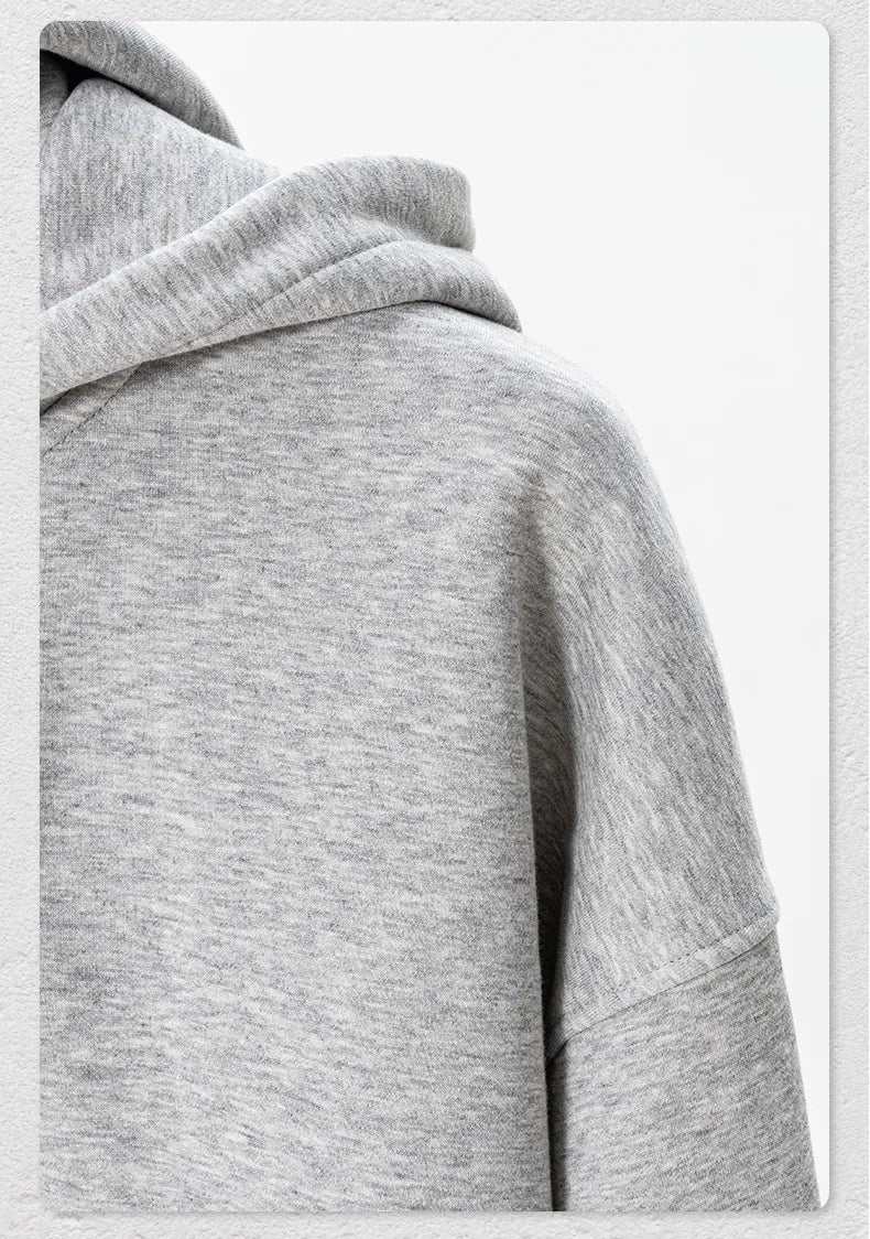 Gray hoodie with a hood on a light gray background