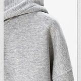 Gray hoodie with a hood on a light gray background