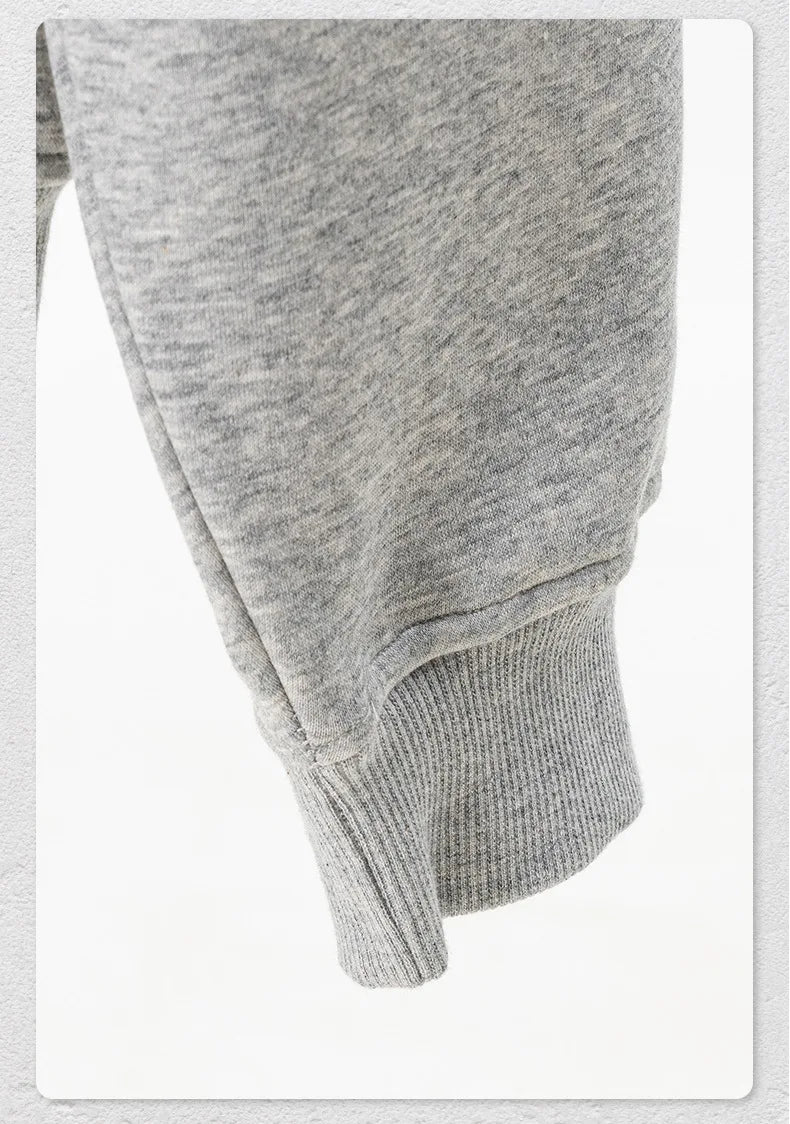 Gray sweatshirt with a hood on a white background