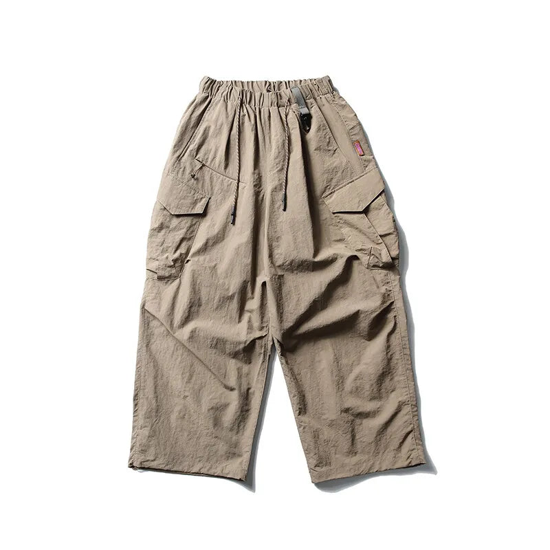 Lk1353 Khaki Parachute cargo pants worn, side view