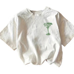 Close-up detail of Margarita Cocktail Club cartoon graphic print on women's white cotton tee