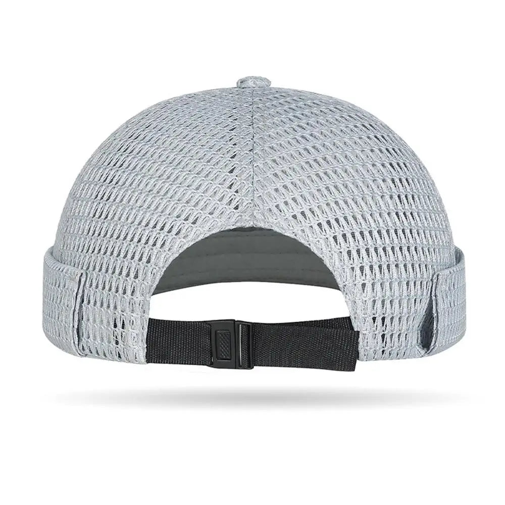 Model wearing mesh brimless docker cap — side on-head view
