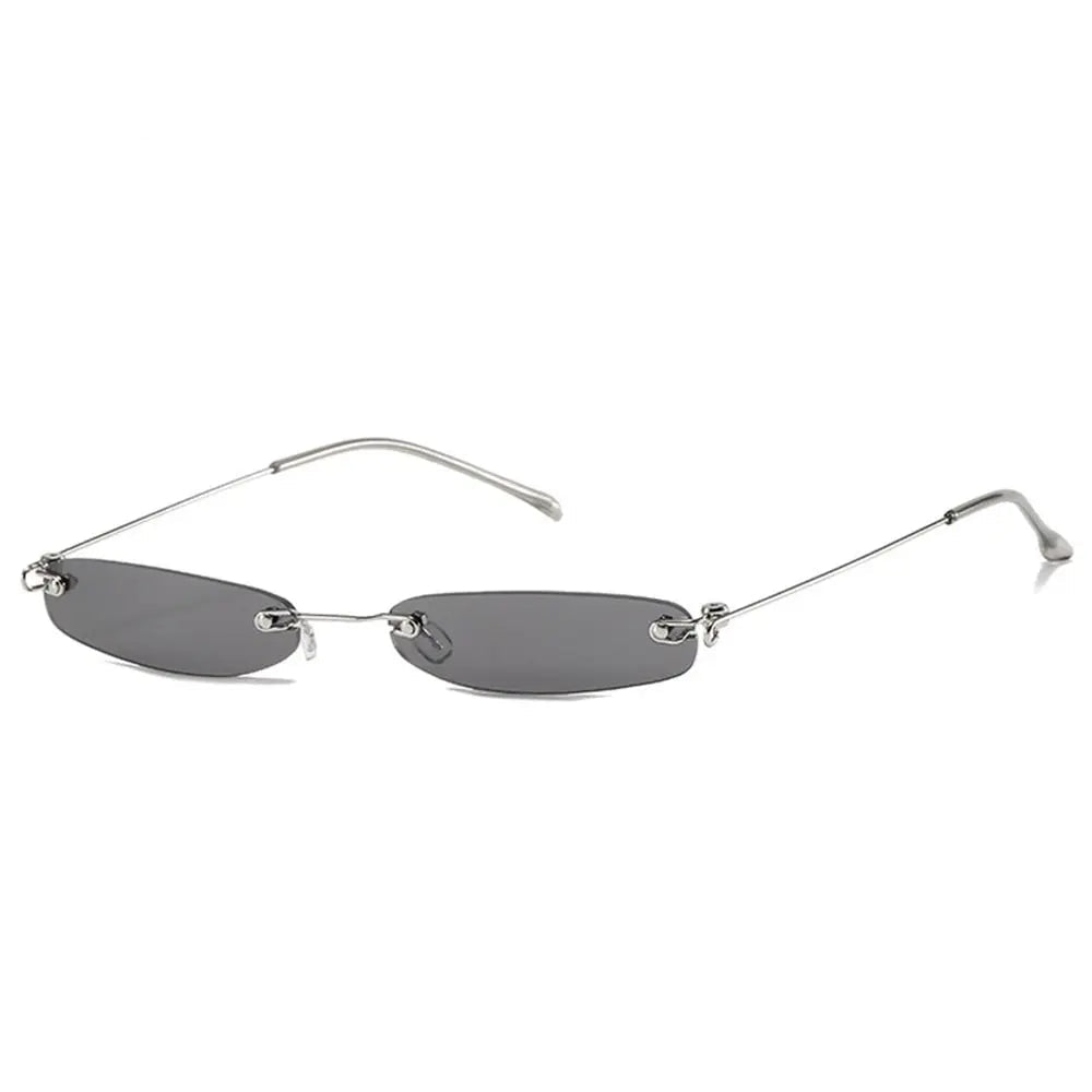 Sunglasses with black gray lenses and thin metal frame on a white background