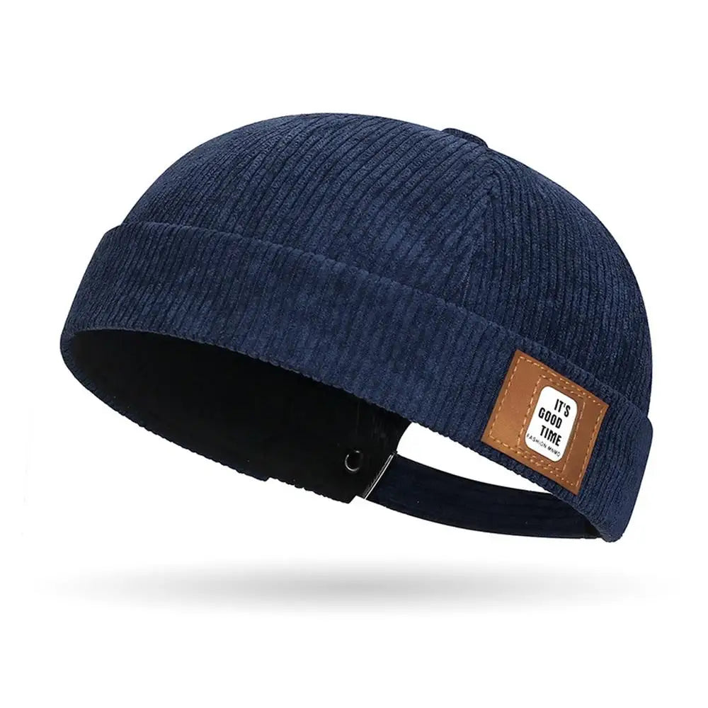 Navy Blue Brimless corduroy docker caps displayed in multiple colorways