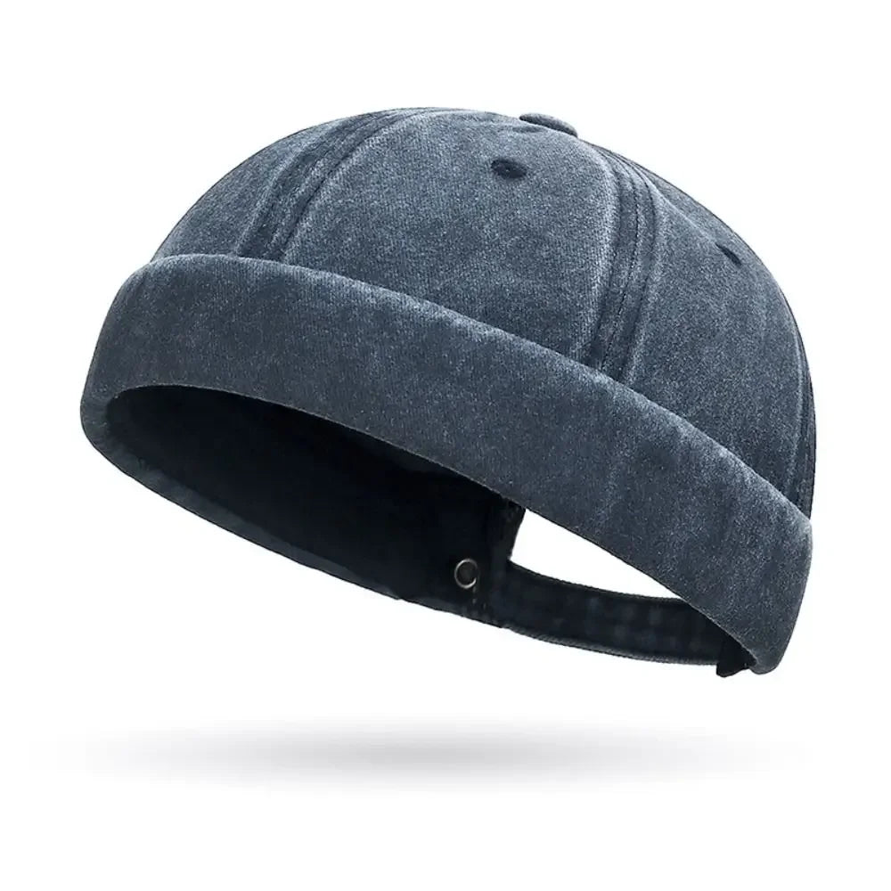 Blue denim cap on a white background