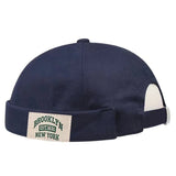 Navy blue cap with a 'Brooklyn New York' patch on a white background
