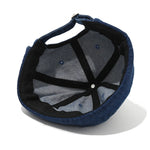 Navy blue cap with mesh back on a white background