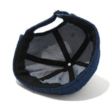 Navy blue cap with mesh back on a white background