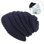 Navy blue knitted beanie with close-up inset on a white background