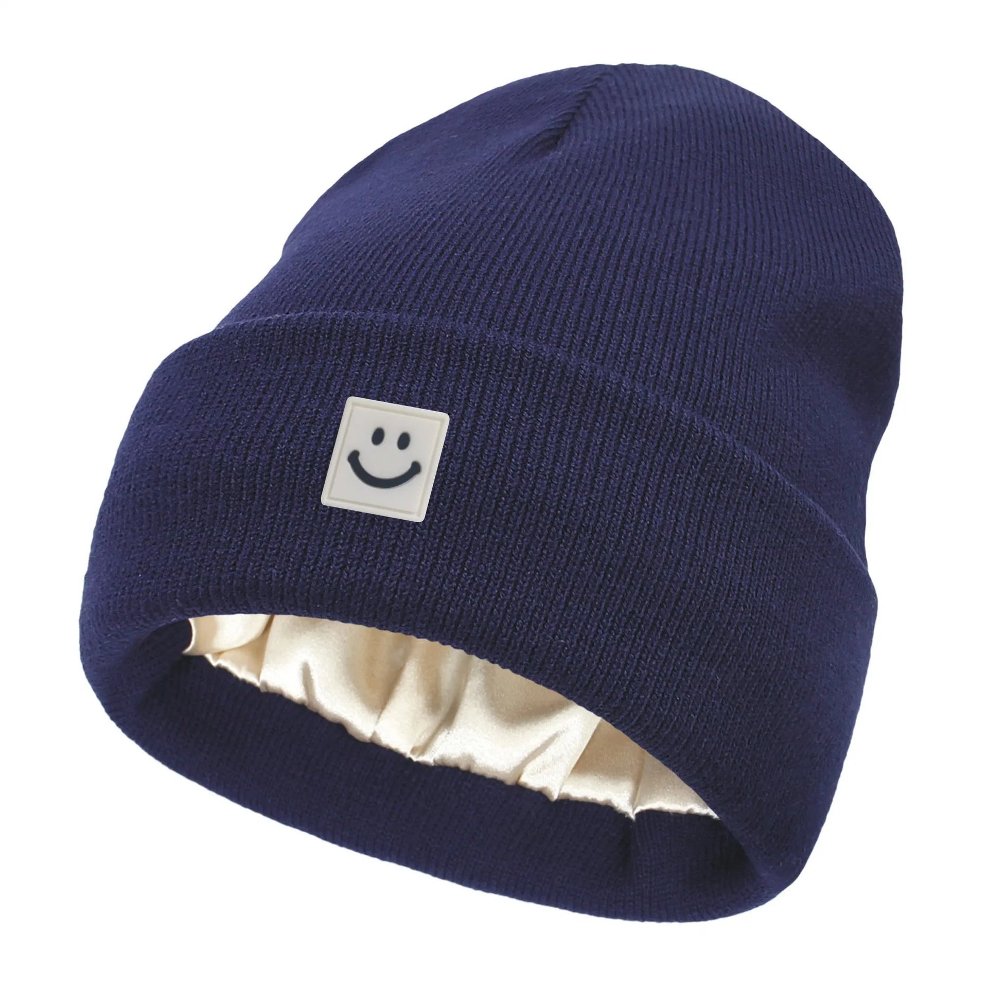 Navy blue beanie with a smiley face logo on a white background
