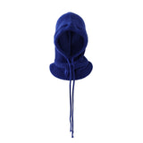 Blue knitted balaclava on a light gray background